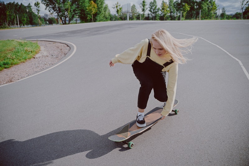A young girl skateboarding.