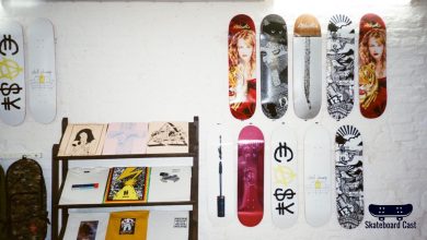 The skateboard wall display showcases various decks on a wall.