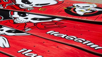 A skateboard with a devil on it.